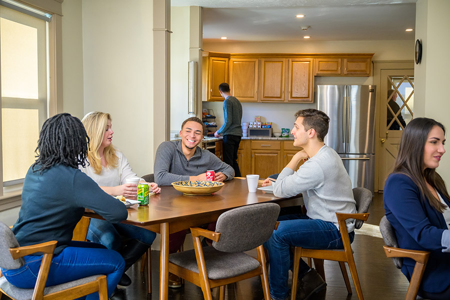 a group of patients at a dining table talking about the detox process in Philadelphia