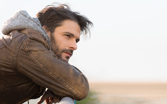 pensive man looking outside