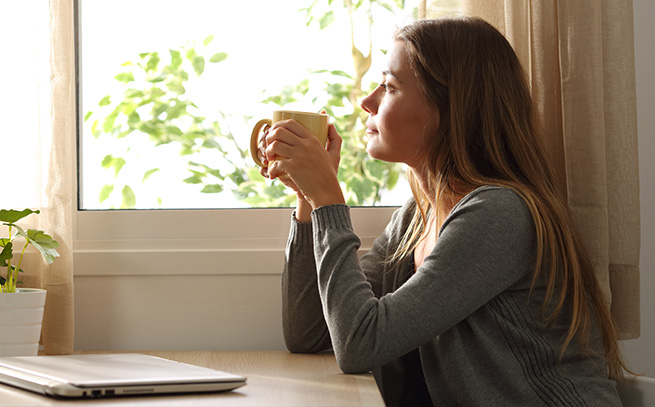 a young woman having coffee